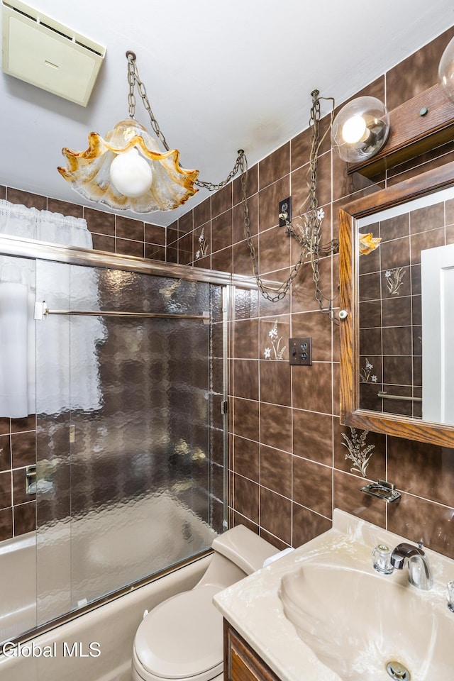 1633 Chrisler Ave, Schenectady, NY 12303 - full bath with tile walls, shower / bath combination with glass door, and vanity
