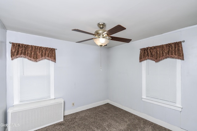 1633 Chrisler Ave, Schenectady, NY 12303 - spare room featuring radiator, dark carpet, and ceiling fan