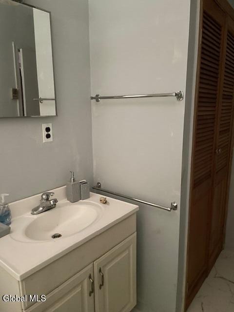 129 Moan And Groan Rd, Hope, NY 12134 - bathroom featuring vanity and marble look tiles