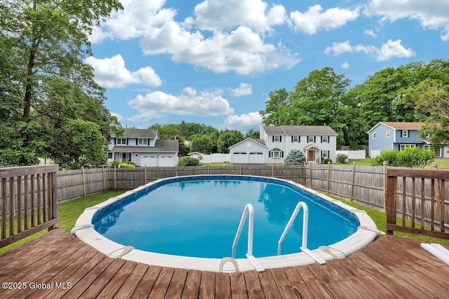 15 Deer Path Dr, Colonie, NY 12205 - view of swimming pool featuring a deck, a fenced backyard, and a residential view