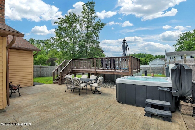 15 Deer Path Dr, Colonie, NY 12205 - deck with a hot tub, a fenced backyard, outdoor dining space, and stairs