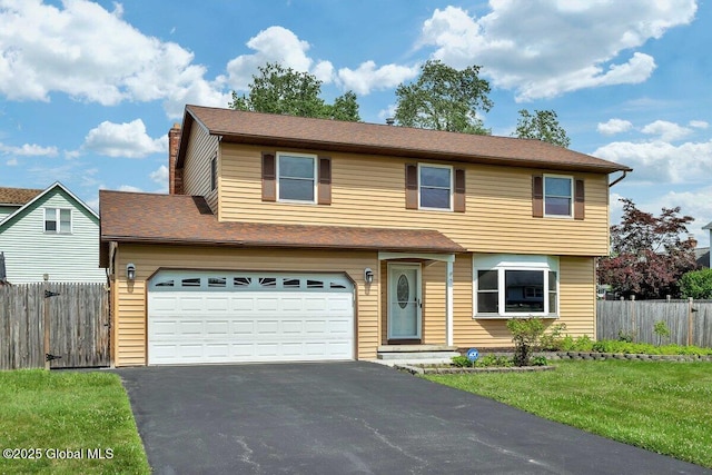 15 Deer Path Dr, Colonie, NY 12205 - view of front of house with driveway, a chimney, and an attached garage