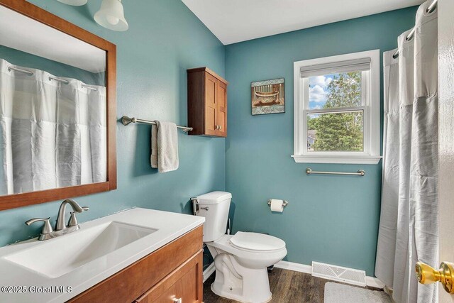 15 Deer Path Dr, Colonie, NY 12205 - full bathroom with wood finished floors, vanity, and a shower with shower curtain