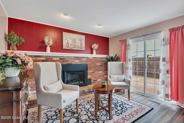 15 Deer Path Dr, Colonie, NY 12205 - living area featuring wood finished floors, a fireplace, and ornamental molding