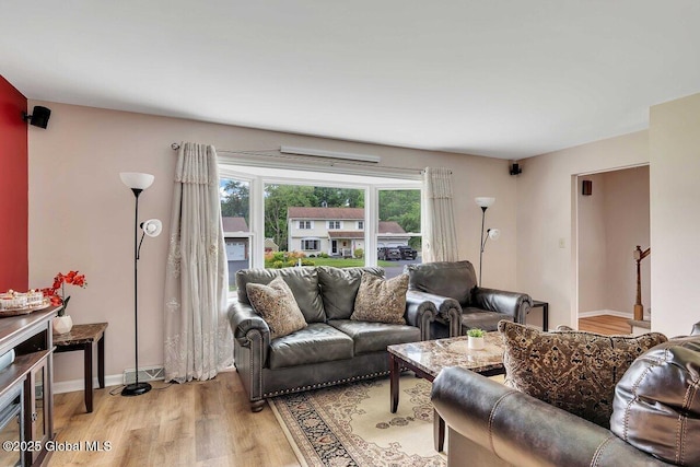 15 Deer Path Dr, Colonie, NY 12205 - living room featuring light wood-style floors and baseboards