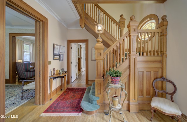 202 W 1st Ave, Johnstown, NY 12095 - entrance foyer featuring stairway, wood finished floors, and ornamental molding
