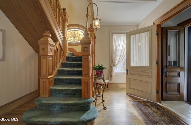 202 W 1st Ave, Johnstown, NY 12095 - staircase featuring wood finished floors and crown molding