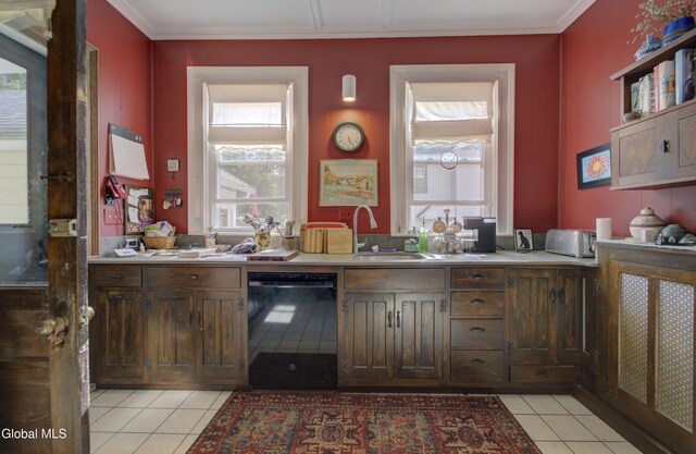 202 W 1st Ave, Johnstown, NY 12095 - kitchen with black dishwasher, light tile patterned floors, healthy amount of natural light, light countertops, and ornamental molding