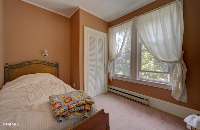 202 W 1st Ave, Johnstown, NY 12095 - carpeted bedroom with a baseboard heating unit, a closet, and ornamental molding