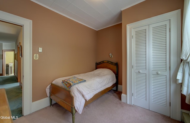 202 W 1st Ave, Johnstown, NY 12095 - carpeted bedroom featuring ornamental molding and a closet