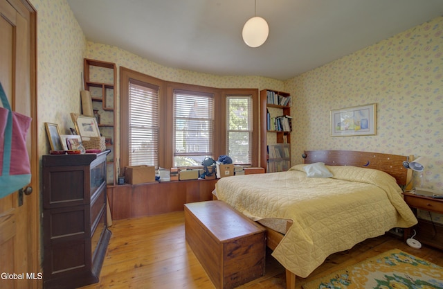202 W 1st Ave, Johnstown, NY 12095 - bedroom with wallpapered walls and light wood-type flooring