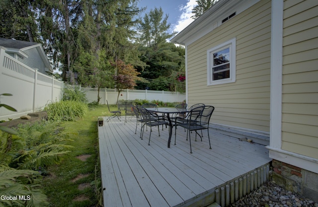 202 W 1st Ave, Johnstown, NY 12095 - wooden deck with a fenced backyard and outdoor dining space