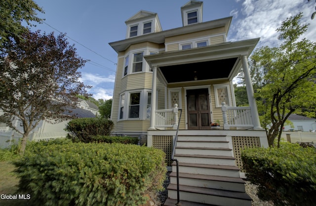 202 W 1st Ave, Johnstown, NY 12095 - view of front of house featuring covered porch