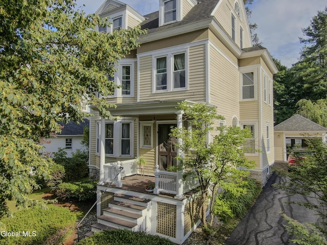 202 W 1st Ave, Johnstown, NY 12095 - view of front of house with a porch and a shingled roof