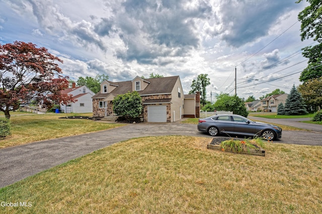 2834 Halsey Dr, Schenectady, NY 12304 - cape cod-style house with asphalt driveway, stone siding, a front yard, a residential view, and a garage