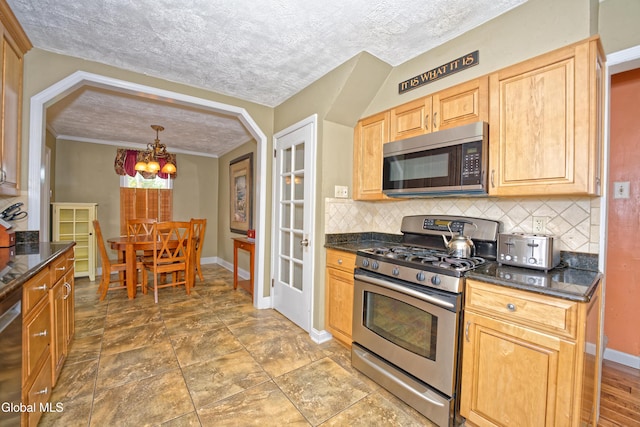 2834 Halsey Dr, Schenectady, NY 12304 - kitchen with appliances with stainless steel finishes, a chandelier, backsplash, light brown cabinetry, and arched walkways