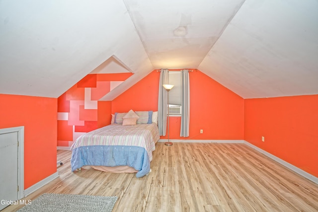 2834 Halsey Dr, Schenectady, NY 12304 - bedroom featuring wood finished floors and lofted ceiling