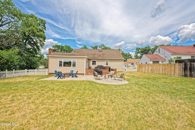 2834 Halsey Dr, Schenectady, NY 12304 - rear view of house with a chimney, a patio, and a fenced backyard