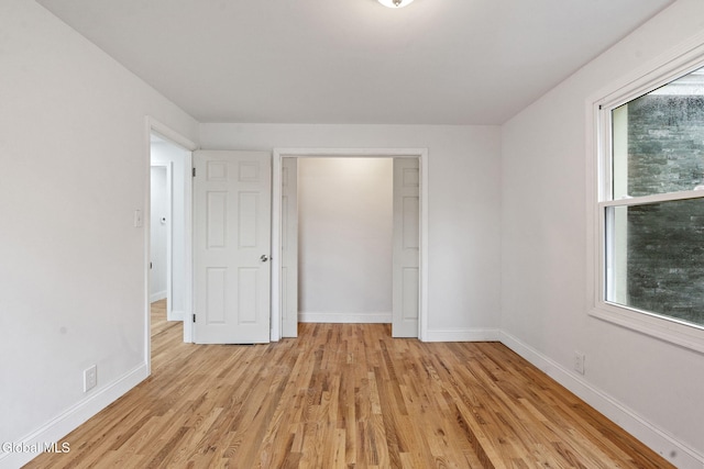 479 Albany Shaker Rd, Colonie, NY 12211 - unfurnished bedroom featuring light wood-style flooring and baseboards