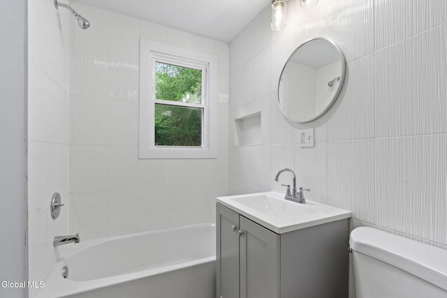 479 Albany Shaker Rd, Colonie, NY 12211 - bathroom featuring tile walls, vanity, and  shower combination