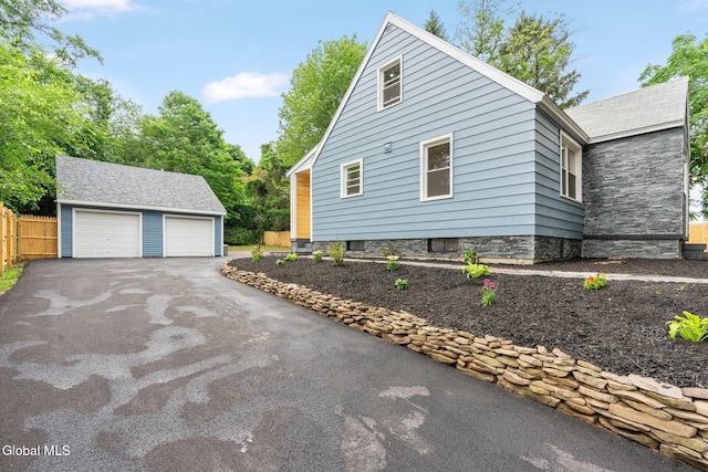 479 Albany Shaker Rd, Colonie, NY 12211 - view of home's exterior featuring an outbuilding and a garage