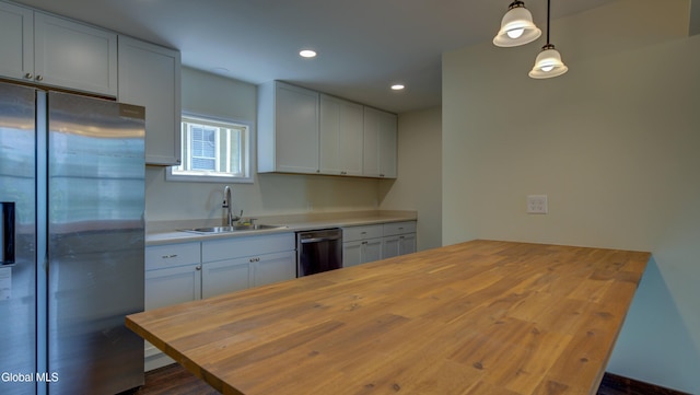 200 Fon Clair St, Johnstown, NY 12095 - kitchen featuring appliances with stainless steel finishes, butcher block counters, recessed lighting, decorative light fixtures, and white cabinetry