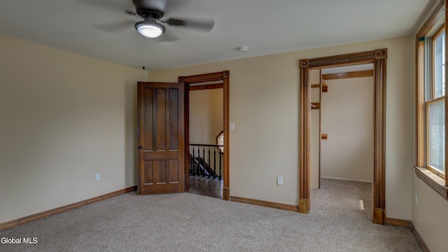 200 Fon Clair St, Johnstown, NY 12095 - unfurnished room with carpet floors, ceiling fan, a smoke detector, and healthy amount of natural light