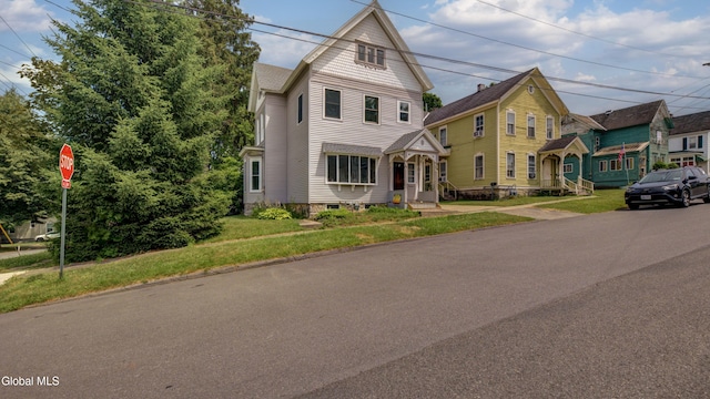 200 Fon Clair St, Johnstown, NY 12095 - victorian-style house featuring a front lawn