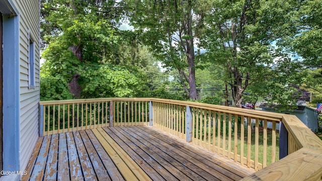 200 Fon Clair St, Johnstown, NY 12095 - wooden deck featuring view of wooded area