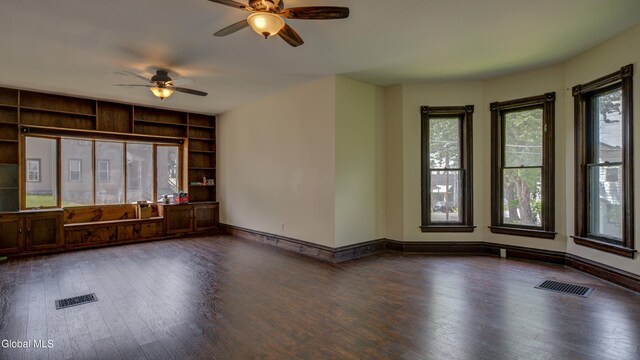 200 Fon Clair St, Johnstown, NY 12095 - spare room featuring ceiling fan, dark wood finished floors, and built in shelves