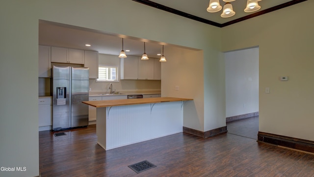 200 Fon Clair St, Johnstown, NY 12095 - kitchen featuring stainless steel appliances, butcher block countertops, a chandelier, dark wood-type flooring, and crown molding