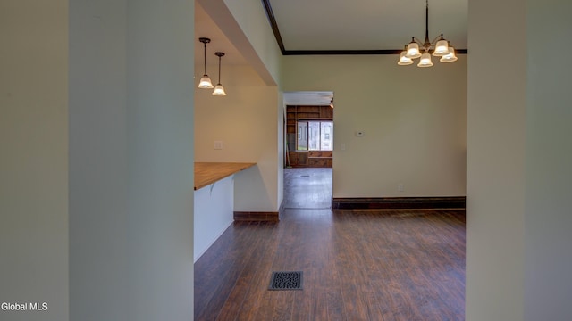 200 Fon Clair St, Johnstown, NY 12095 - unfurnished dining area featuring dark wood-style floors, a chandelier, and ornamental molding