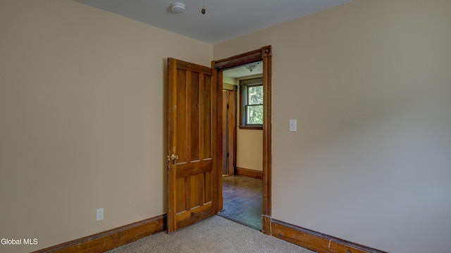 200 Fon Clair St, Johnstown, NY 12095 - carpeted empty room featuring baseboards and a smoke detector