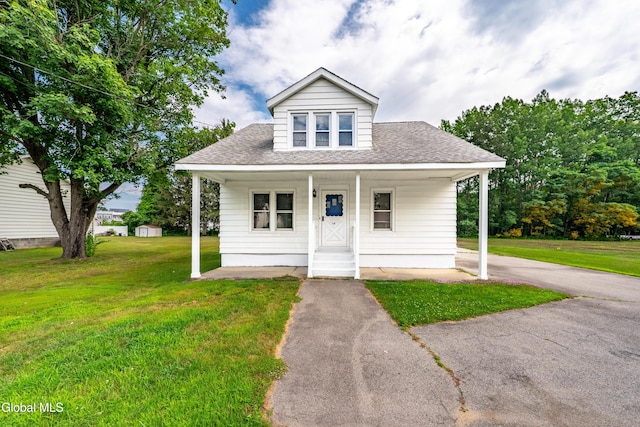 1012 Princetown Rd, Rotterdam, NY 12306 - bungalow-style home featuring roof with shingles, a front yard, and a porch