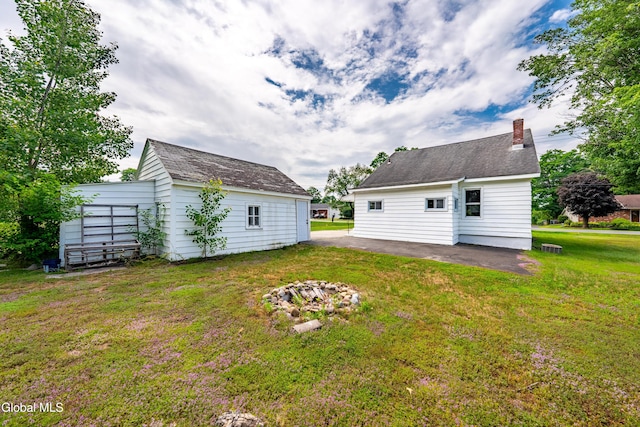 1012 Princetown Rd, Rotterdam, NY 12306 - view of green lawn with a patio and an outbuilding