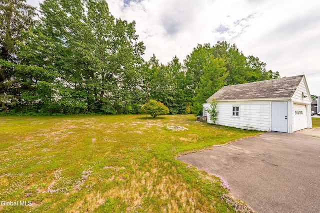 1012 Princetown Rd, Rotterdam, NY 12306 - view of green lawn with an outbuilding, driveway, and a detached garage