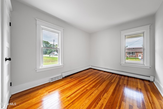 1012 Princetown Rd, Rotterdam, NY 12306 - empty room with a baseboard heating unit and hardwood / wood-style floors