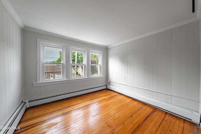 1012 Princetown Rd, Rotterdam, NY 12306 - unfurnished room featuring ornamental molding, a baseboard radiator, hardwood / wood-style flooring, a baseboard heating unit, and wooden walls