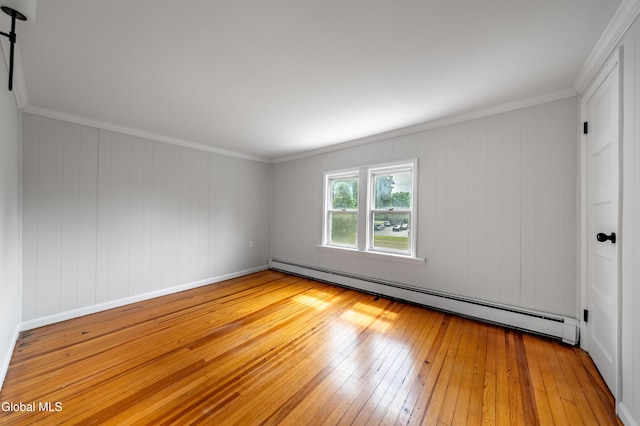 1012 Princetown Rd, Rotterdam, NY 12306 - spare room featuring a baseboard heating unit, wood-type flooring, and crown molding