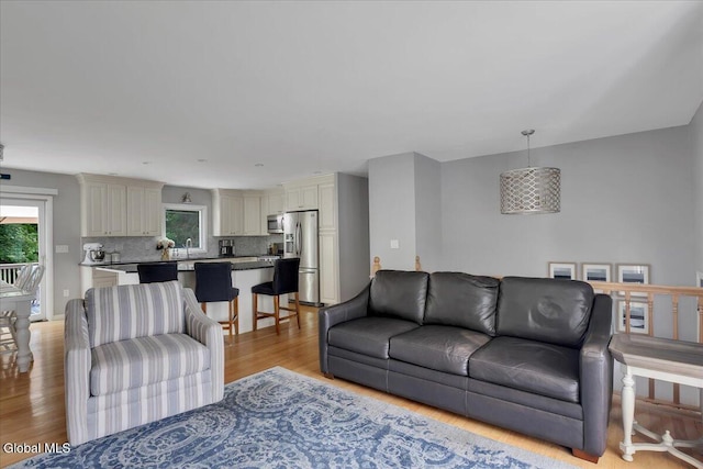 33 Comely Ln, Colonie, NY 12110 - living room featuring light wood finished floors