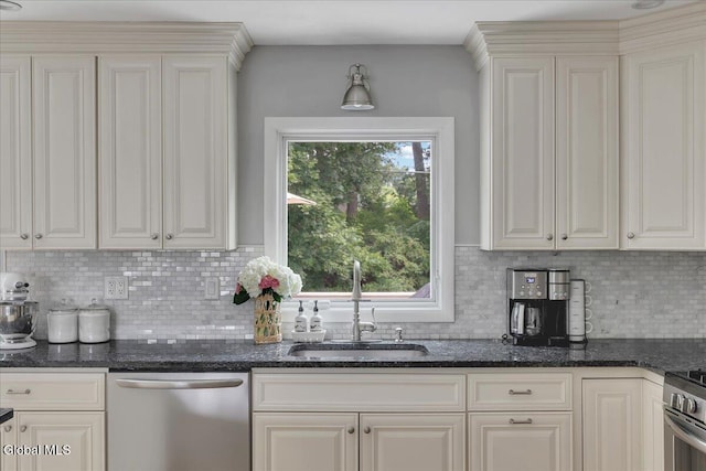 33 Comely Ln, Colonie, NY 12110 - kitchen with appliances with stainless steel finishes, backsplash, dark stone countertops, and white cabinets