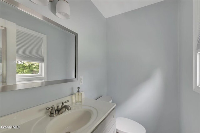 33 Comely Ln, Colonie, NY 12110 - bathroom featuring vanity and lofted ceiling