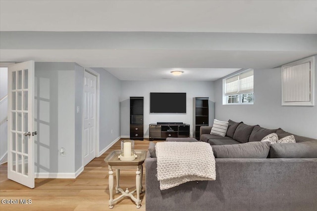 33 Comely Ln, Colonie, NY 12110 - living area with light wood-style flooring and baseboards