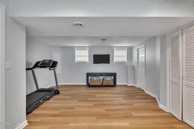 33 Comely Ln, Colonie, NY 12110 - exercise area with light wood-style floors and baseboards