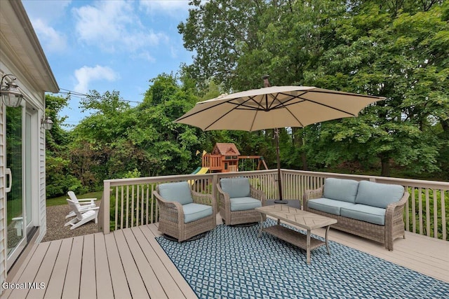 33 Comely Ln, Colonie, NY 12110 - deck featuring outdoor lounge area, a playground, and view of wooded area
