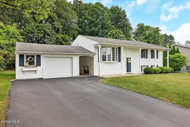 33 Comely Ln, Colonie, NY 12110 - split foyer home featuring an attached garage, a front lawn, and driveway