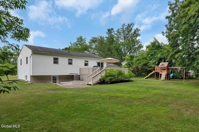 33 Comely Ln, Colonie, NY 12110 - rear view of property with a playground, a lawn, a wooden deck, and stairs