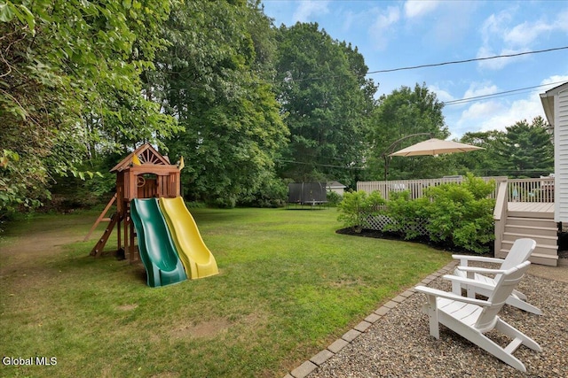 33 Comely Ln, Colonie, NY 12110 - view of grassy yard with a playground and a wooden deck