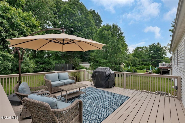33 Comely Ln, Colonie, NY 12110 - deck with an outdoor living space, area for grilling, and view of wooded area