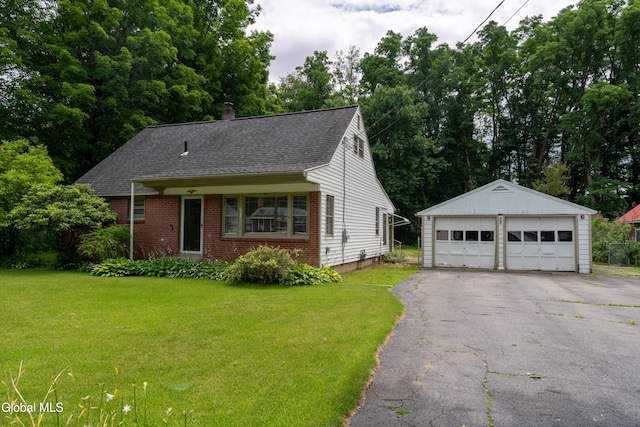 98 Meadowbrook Rd, Saratoga Springs, NY 12866 - view of front facade with an outbuilding, a garage, a front yard, and a shingled roof